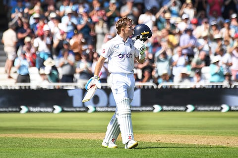 Ollie Pope celebrates a century against West Indies